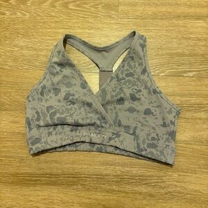 Alphalete surface wrap bra in peddle stone grey